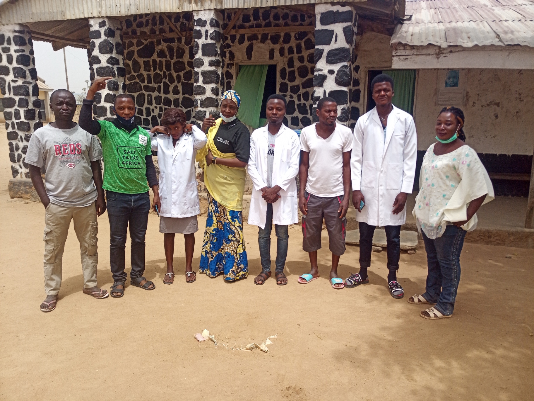 A group of health workers and citizens outside a public health facility