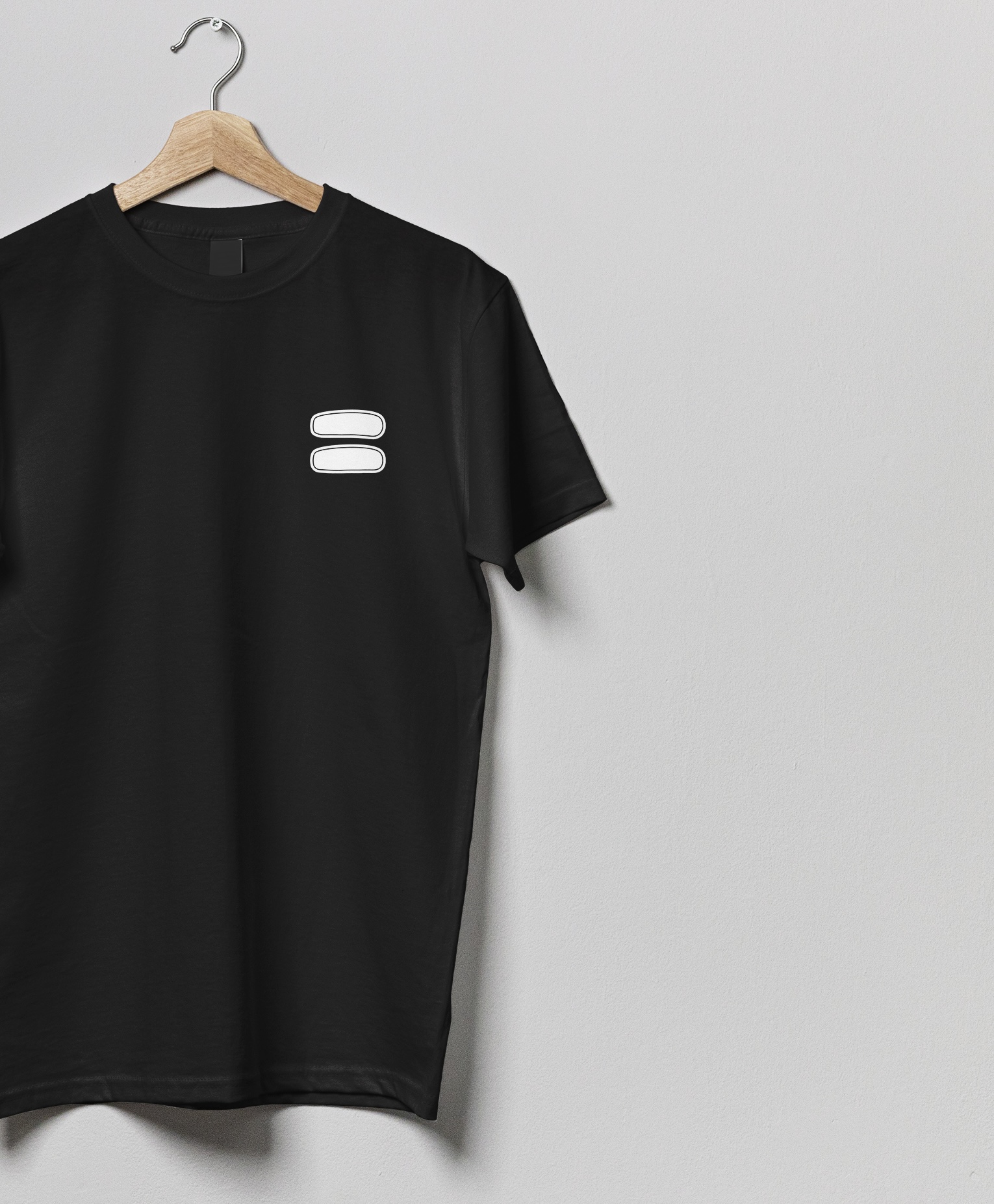 Black Salt House t-shirt on a hanger with a white equals-sign inclusion mark on the chest